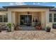 Spacious back patio featuring a grill, outdoor seating and a ceiling fan at 5182 Appenine E Loop, St Cloud, FL 34771