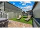 Backyard with an artificial turf area, tanning chairs and a trampoline for active outdoor enjoyment at 5182 Appenine E Loop, St Cloud, FL 34771