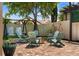 Inviting brick patio with Adirondack chairs arranged around a fire pit and a charming swing set at 5182 Appenine E Loop, St Cloud, FL 34771