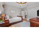Spacious bedroom with ceiling fan, wood floors, and closet at 5182 Appenine E Loop, St Cloud, FL 34771