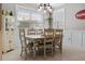 Bright dining area with a vintage-style table and chairs, enhanced by natural light and classic decor at 5182 Appenine E Loop, St Cloud, FL 34771