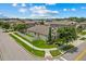 Corner lot home with landscaped yard, modern exterior, and well-manicured lawn adds to its curb appeal at 5182 Appenine E Loop, St Cloud, FL 34771