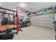Spacious garage featuring a variety of gym equipment and ample storage space at 5182 Appenine E Loop, St Cloud, FL 34771