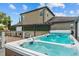 Relax in this backyard hot tub with jets, set against the backdrop of a well-maintained home at 5182 Appenine E Loop, St Cloud, FL 34771