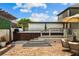 Backyard patio featuring a hot tub with multi-level deck, offering a relaxing outdoor retreat at 5182 Appenine E Loop, St Cloud, FL 34771