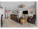 Comfortable living room connected to a kitchen with stylish decor, and a leather sofa set at 5182 Appenine E Loop, St Cloud, FL 34771