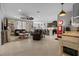 Open-concept living room with a vintage gas pump decor, a kitchen island, and comfortable seating at 5182 Appenine E Loop, St Cloud, FL 34771