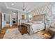 Charming bedroom featuring wood floors, decorative walls, and a tray ceiling at 5182 Appenine E Loop, St Cloud, FL 34771