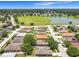 Aerial view of the neighborhood featuring a lake and community park at 5431 Lochdale Dr, Orlando, FL 32818