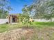 Backyard featuring a covered patio and mature landscaping at 5431 Lochdale Dr, Orlando, FL 32818