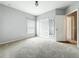Bedroom with closet, carpeted floor and neutral paint, offering a bright and inviting space at 5431 Lochdale Dr, Orlando, FL 32818