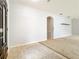 Foyer featuring tile flooring, neutral wall paint, and an archway leading to the carpeted living areas at 5431 Lochdale Dr, Orlando, FL 32818