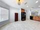 Bright kitchen featuring tile flooring, black appliances, and updated cabinetry, ready for cooking at 5431 Lochdale Dr, Orlando, FL 32818