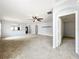 Spacious living room showing kitchen, front entry, and doorway to another room at 5431 Lochdale Dr, Orlando, FL 32818