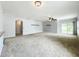 Bright living room featuring a ceiling fan, access to the patio, and open floor plan at 5431 Lochdale Dr, Orlando, FL 32818