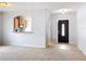 Bright living room with a view of the kitchen and front entry at 5431 Lochdale Dr, Orlando, FL 32818