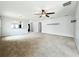Spacious living room with a ceiling fan, neutral paint, and arched entryways leading to other rooms at 5431 Lochdale Dr, Orlando, FL 32818