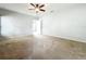 Bright and spacious main bedroom with a ceiling fan and carpeted floor at 5431 Lochdale Dr, Orlando, FL 32818