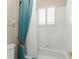 Bathroom shower and tub area with tile and window at 600 Egret Place Dr, Winter Garden, FL 34787