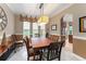 Inviting dining area featuring a chandelier and a view into the kitchen at 600 Egret Place Dr, Winter Garden, FL 34787