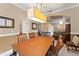 View of the dining room showcasing a light fixture and multiple rooms of the home at 600 Egret Place Dr, Winter Garden, FL 34787