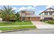 Attractive two-story home with a lush front yard, a private driveway, and vibrant landscaping, offering a welcoming curb appeal at 600 Egret Place Dr, Winter Garden, FL 34787