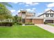 Charming two-story home featuring a well-manicured lawn, lush landscaping, and a welcoming facade with a two car garage at 600 Egret Place Dr, Winter Garden, FL 34787