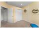 Exercise room featuring neutral carpet, workout equipment, and a closet for storage at 600 Egret Place Dr, Winter Garden, FL 34787