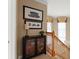Hallway view with staircase and decorative shelving unit at 600 Egret Place Dr, Winter Garden, FL 34787