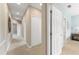 Neutral hallway showcasing multiple entryways and closet space at 600 Egret Place Dr, Winter Garden, FL 34787