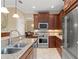 Modern kitchen featuring stainless steel appliances, granite countertops, and ample cabinet space, perfect for cooking at 600 Egret Place Dr, Winter Garden, FL 34787