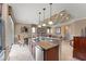 Open concept kitchen with granite counters, stainless steel appliances, and eat in dining area at 600 Egret Place Dr, Winter Garden, FL 34787