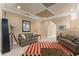 Bright living room with neutral walls, tile floors, and multiple seating arrangements at 600 Egret Place Dr, Winter Garden, FL 34787