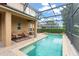 Inviting screened swimming pool with a spacious deck and comfortable seating area, perfect for relaxation and entertaining at 600 Egret Place Dr, Winter Garden, FL 34787