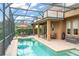 Wonderful screened pool area with comfortable seating and manicured landscaping, perfect for outdoor enjoyment and relaxation at 600 Egret Place Dr, Winter Garden, FL 34787