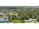 Wide angle aerial view of a residential neighborhood with established trees, roads, and sidewalks at 8735 Rancho Ct, Orlando, FL 32836