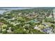 Wide angle aerial view of a residential neighborhood with established trees, roads, and sidewalks at 8735 Rancho Ct, Orlando, FL 32836