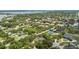 Wide angle aerial view of a residential neighborhood with established trees, roads, and sidewalks at 8735 Rancho Ct, Orlando, FL 32836
