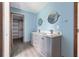 Bathroom features a double vanity and an open closet at 8735 Rancho Ct, Orlando, FL 32836