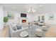 Living room featuring a fireplace, french doors, neutral furniture, and elegant decor at 8735 Rancho Ct, Orlando, FL 32836