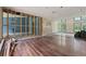 Spacious living area showing exposed framing and hardwood floors at 8735 Rancho Ct, Orlando, FL 32836