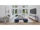 Bright living room with a modern aesthetic, large windows, and neutral color palette at 8735 Rancho Ct, Orlando, FL 32836