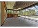 A screened-in porch needing repair leads to a pool at 8735 Rancho Ct, Orlando, FL 32836