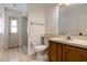 Bathroom featuring a vanity and enclosed shower, with a door leading outside at 9108 N Bay Boulevard, Orlando, FL 32819