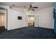 Large bedroom with a ceiling fan and access to an ensuite bathroom at 9108 N Bay Boulevard, Orlando, FL 32819
