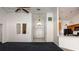 Inviting entryway featuring high ceilings, double doors, and easy access to the kitchen at 9108 N Bay Boulevard, Orlando, FL 32819