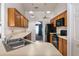 Well-lit kitchen featuring plenty of counter space and modern black appliances at 9108 N Bay Boulevard, Orlando, FL 32819