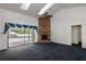 Bright living room with high ceilings, a brick fireplace, and sliding doors offering views of the pool at 9108 N Bay Boulevard, Orlando, FL 32819
