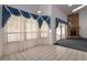 Bright living room featuring high ceilings, large windows, and a fireplace at 9108 N Bay Boulevard, Orlando, FL 32819