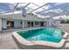 Backyard pool featuring a covered screen and sunbathing area at 9108 N Bay Boulevard, Orlando, FL 32819